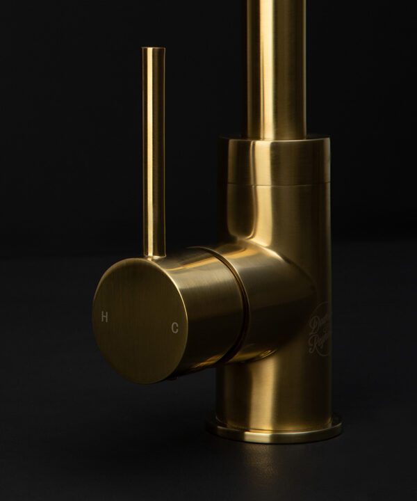 gold kintampo tap close up of handle on black background