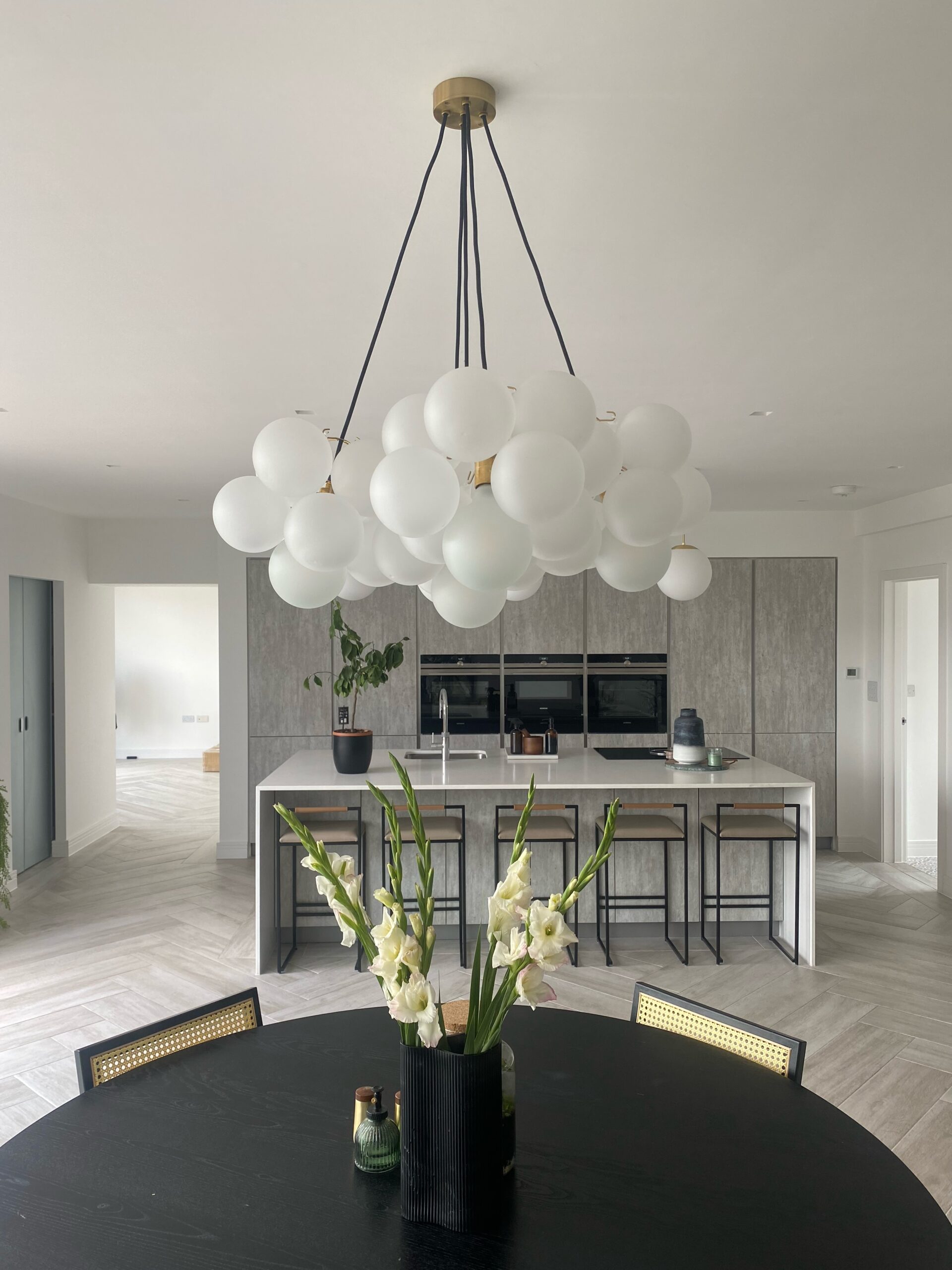 frosted bubble chandelier over a dining room table