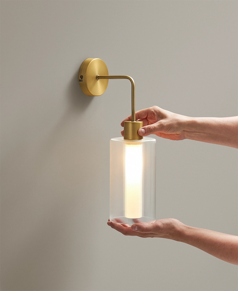gold wall light with glass shade